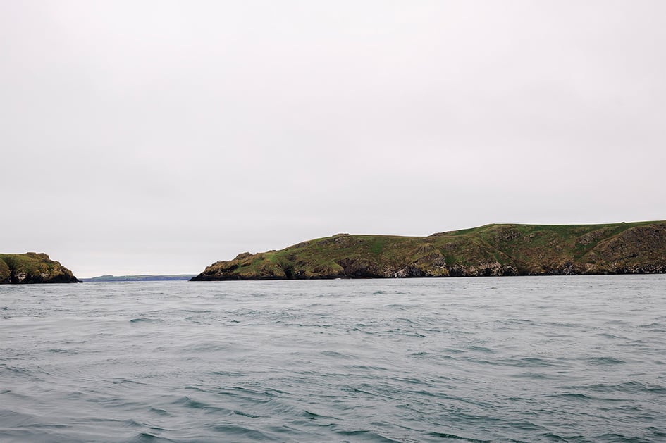 View of the Pembrokeshire coastline from the open boat crossing to Skomer Island