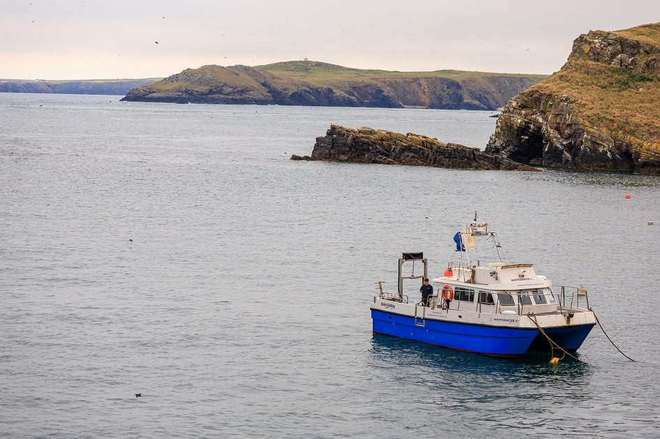 The Skomer Island passenger boat moored in the water near the landing stage